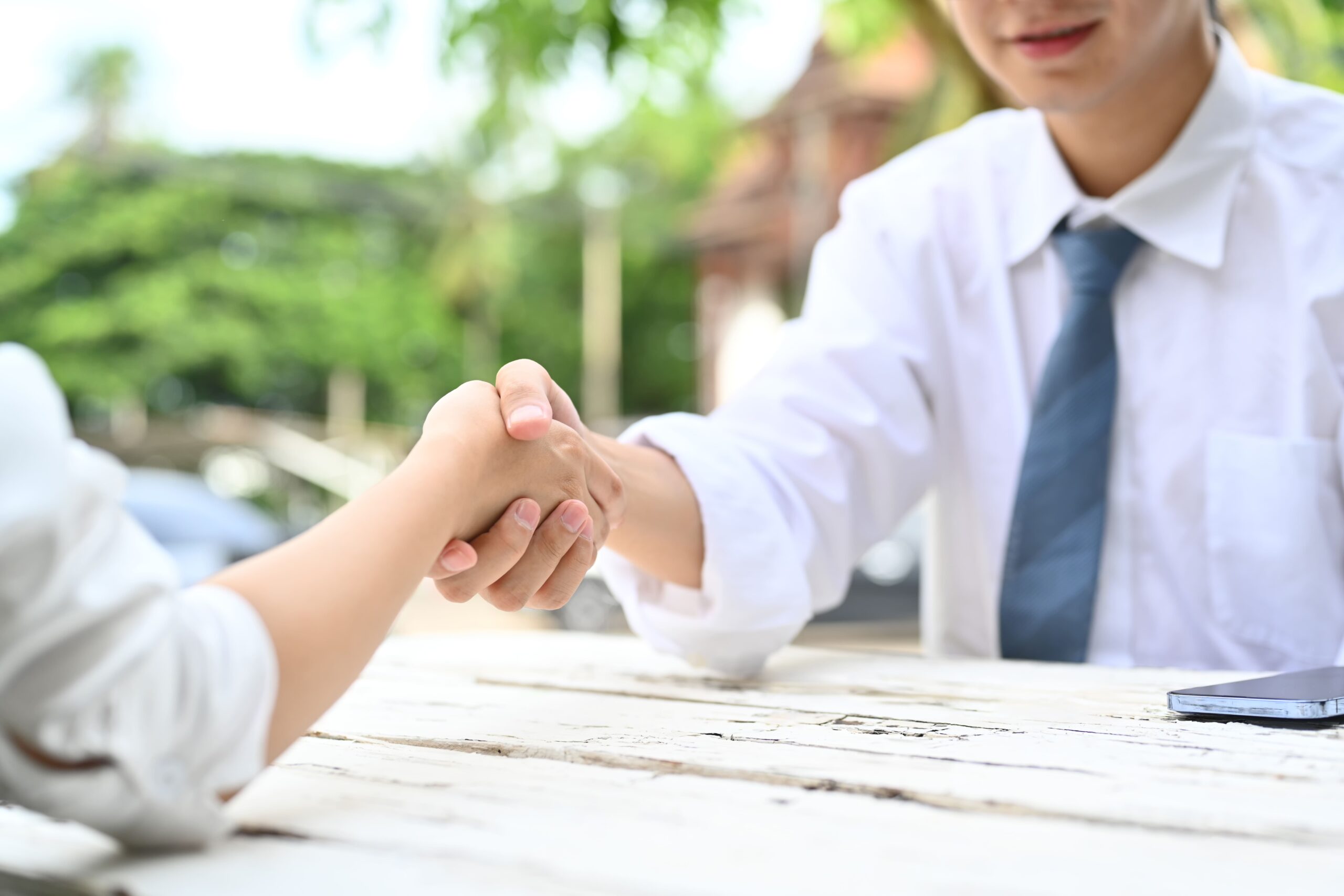 shot-of-businessman-shaking-hands-with-partner-aft-2024-11-27-11-35-02-utc